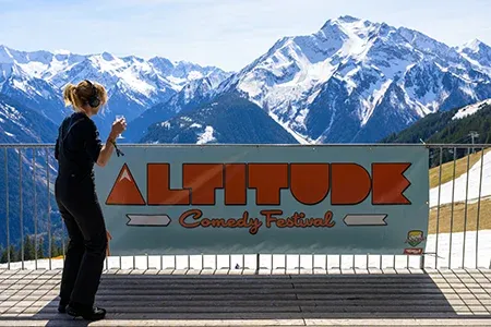 Altitude Banner with snow covered mountains in the background