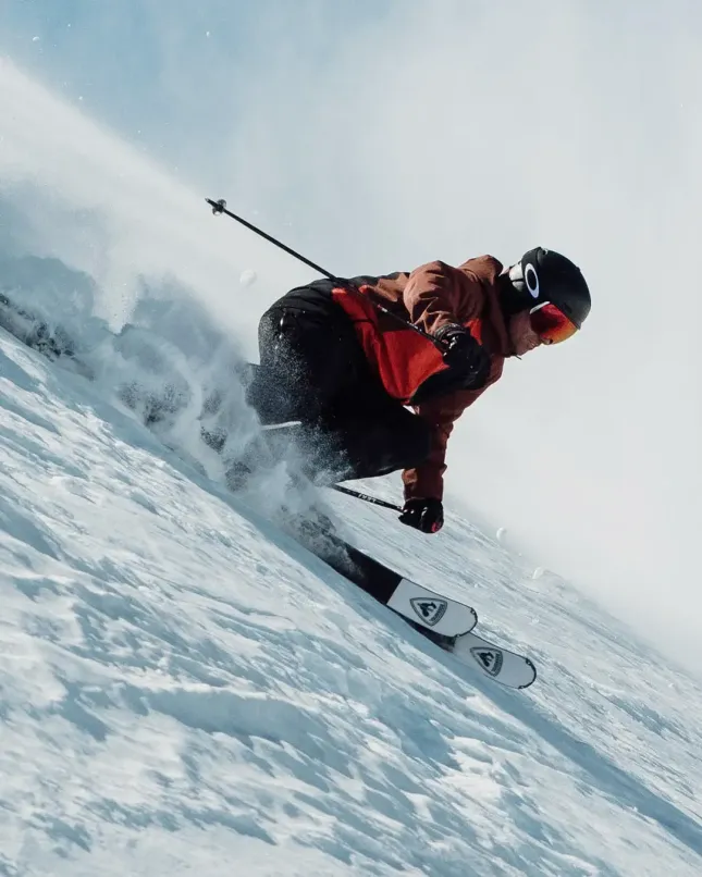 Skier going down a snow slope